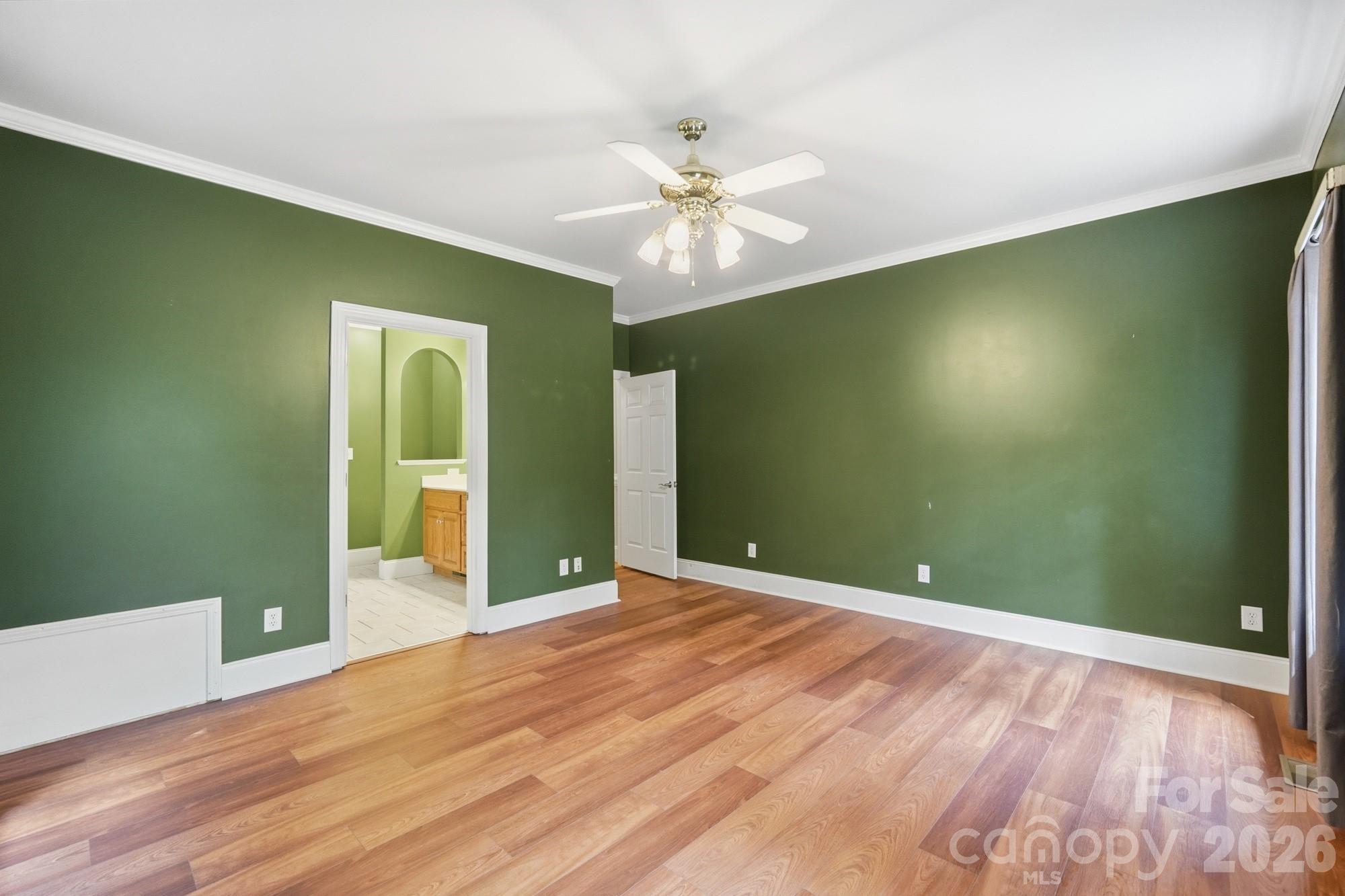 2811 Belk Mill Road Wingate, NC 28174 - Photo 20 of 36 wooden floor in an empty room with a window
