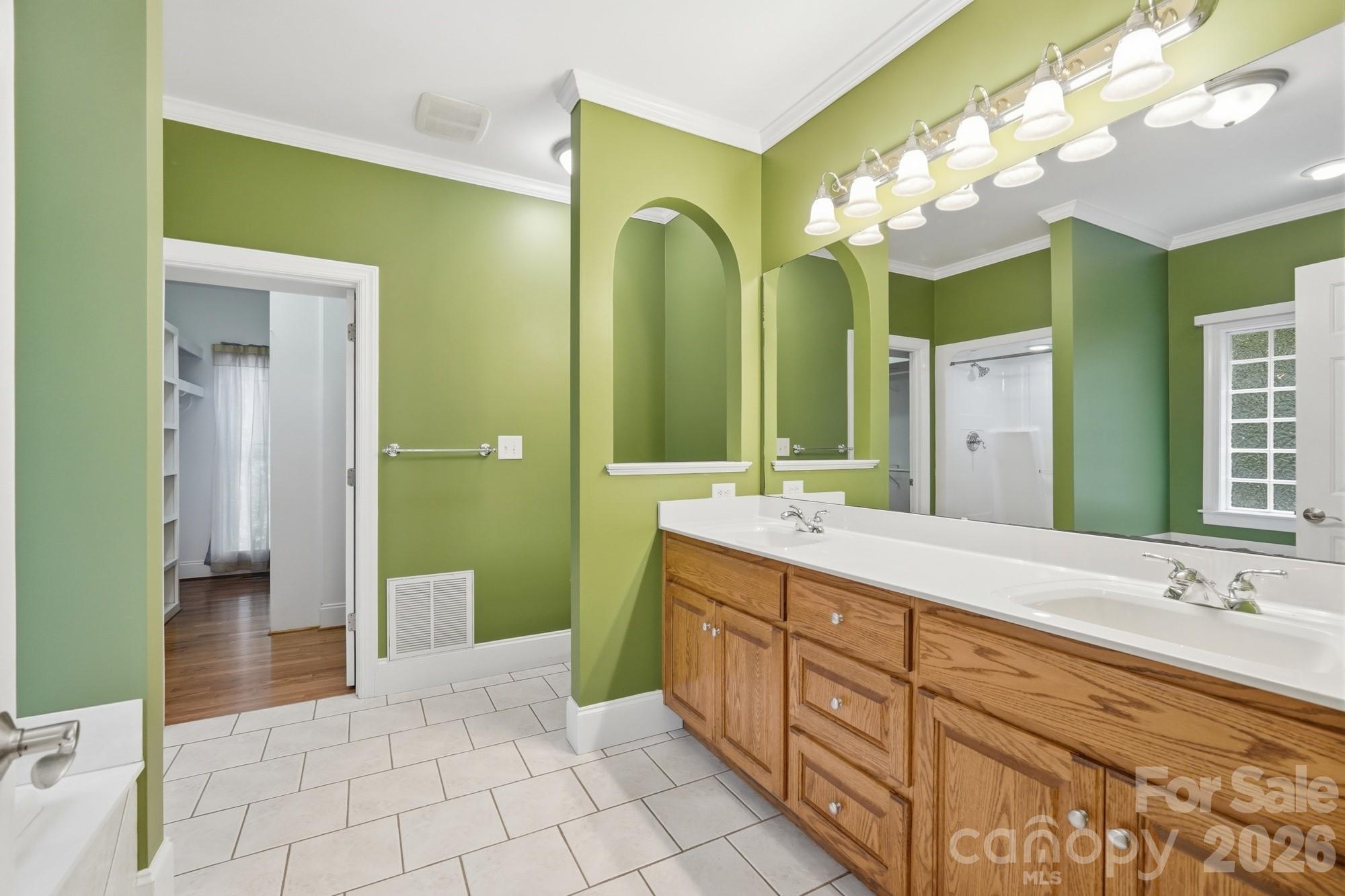2811 Belk Mill Road Wingate, NC 28174 - Photo 21 of 36 a spacious bathroom with a double vanity sink mirror and double