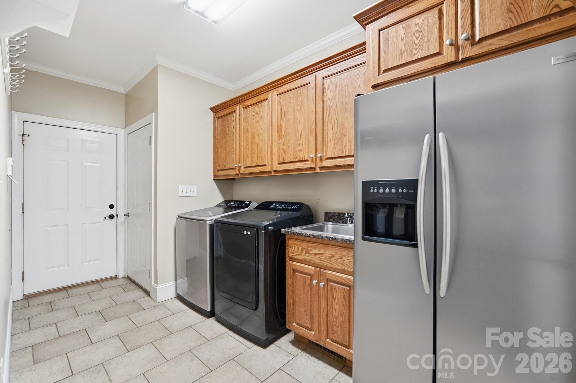 2811 Belk Mill Road Wingate, NC 28174 - Photo 29 of 36 a kitchen with stainless steel appliances granite countertop a refrigerator a stove and a sink with wooden cabinets