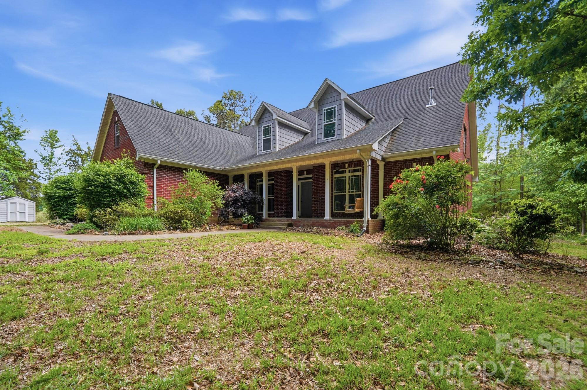 2811 Belk Mill Road Wingate, NC 28174 - Photo 4 of 36 front view of a house with a garden