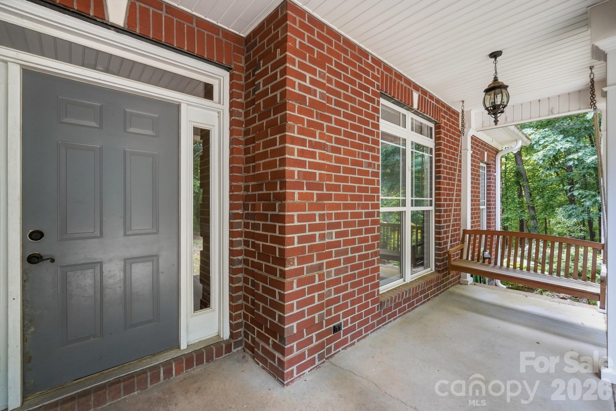 2811 Belk Mill Road Wingate, NC 28174 - Photo 5 of 36 a view of a porch with a door and wooden floor