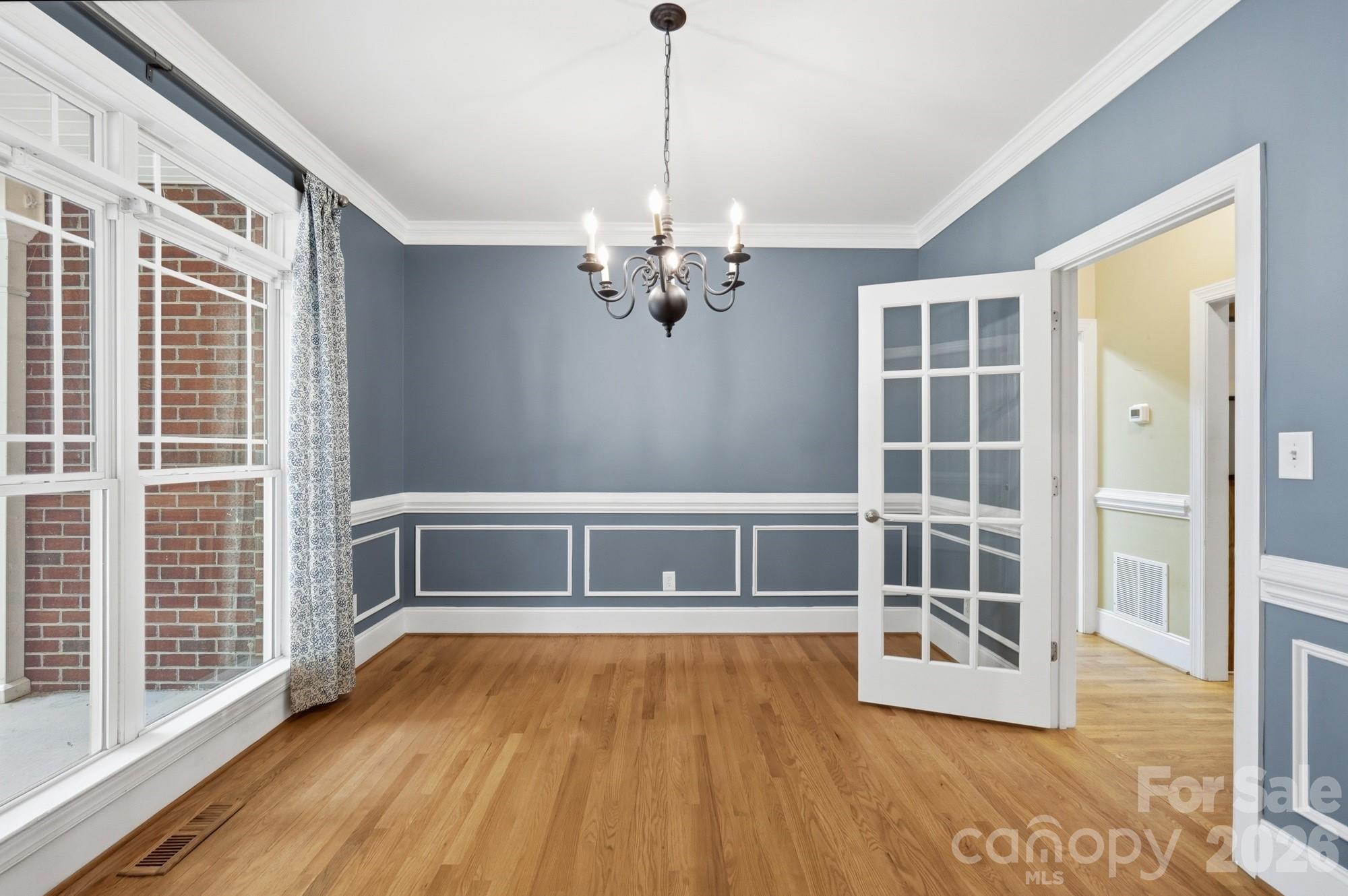 2811 Belk Mill Road Wingate, NC 28174 - Photo 9 of 36 a view of empty room with wooden floor and fan