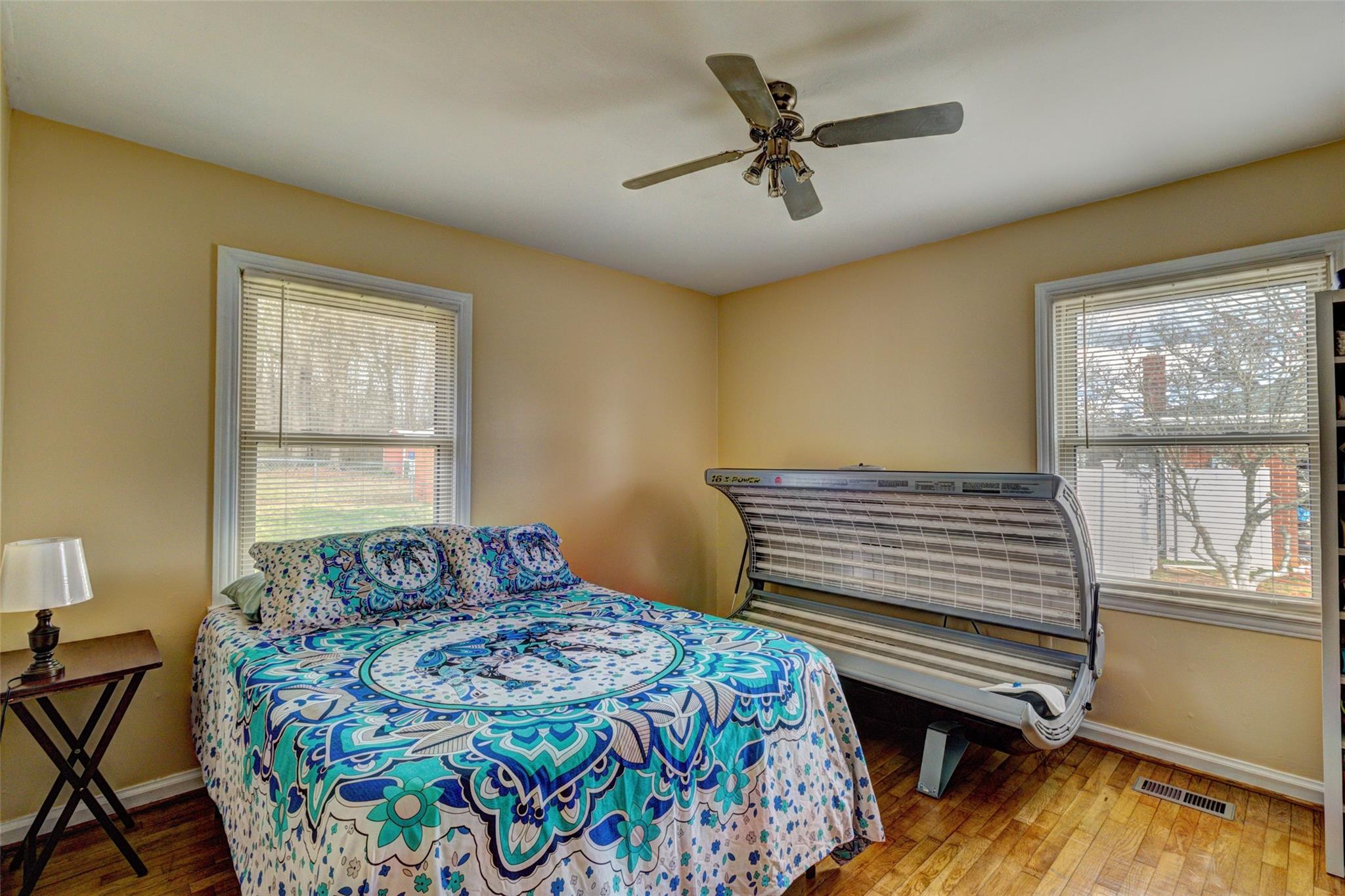 443 Roy Eaker Road Cherryville, NC 28021 - Photo 12 of 15 a bedroom with a bed and a chandelier