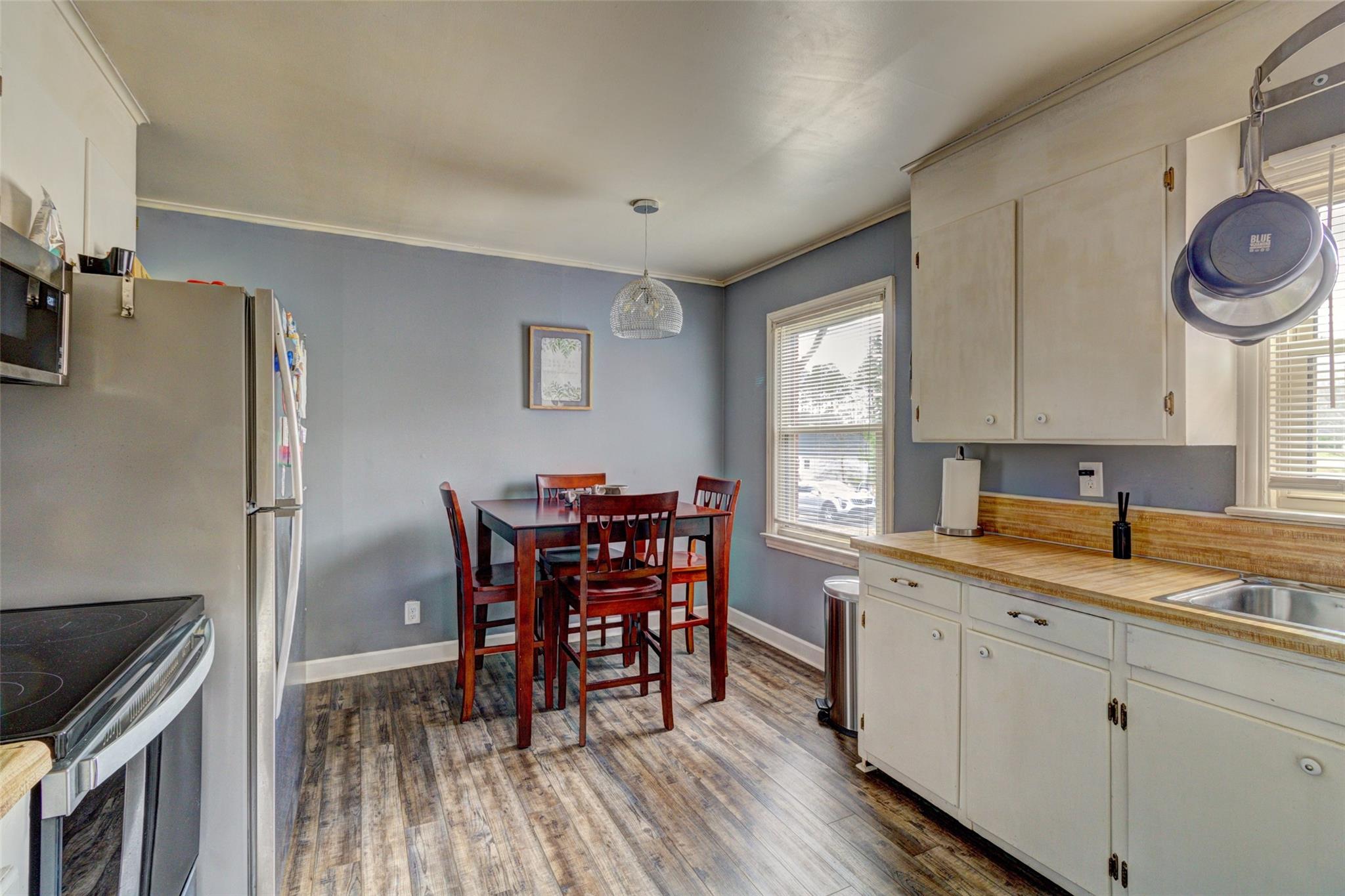 443 Roy Eaker Road Cherryville, NC 28021 - Photo 3 of 15 a kitchen with stainless steel appliances granite countertop a sink a stove a refrigerator dining table and chairs