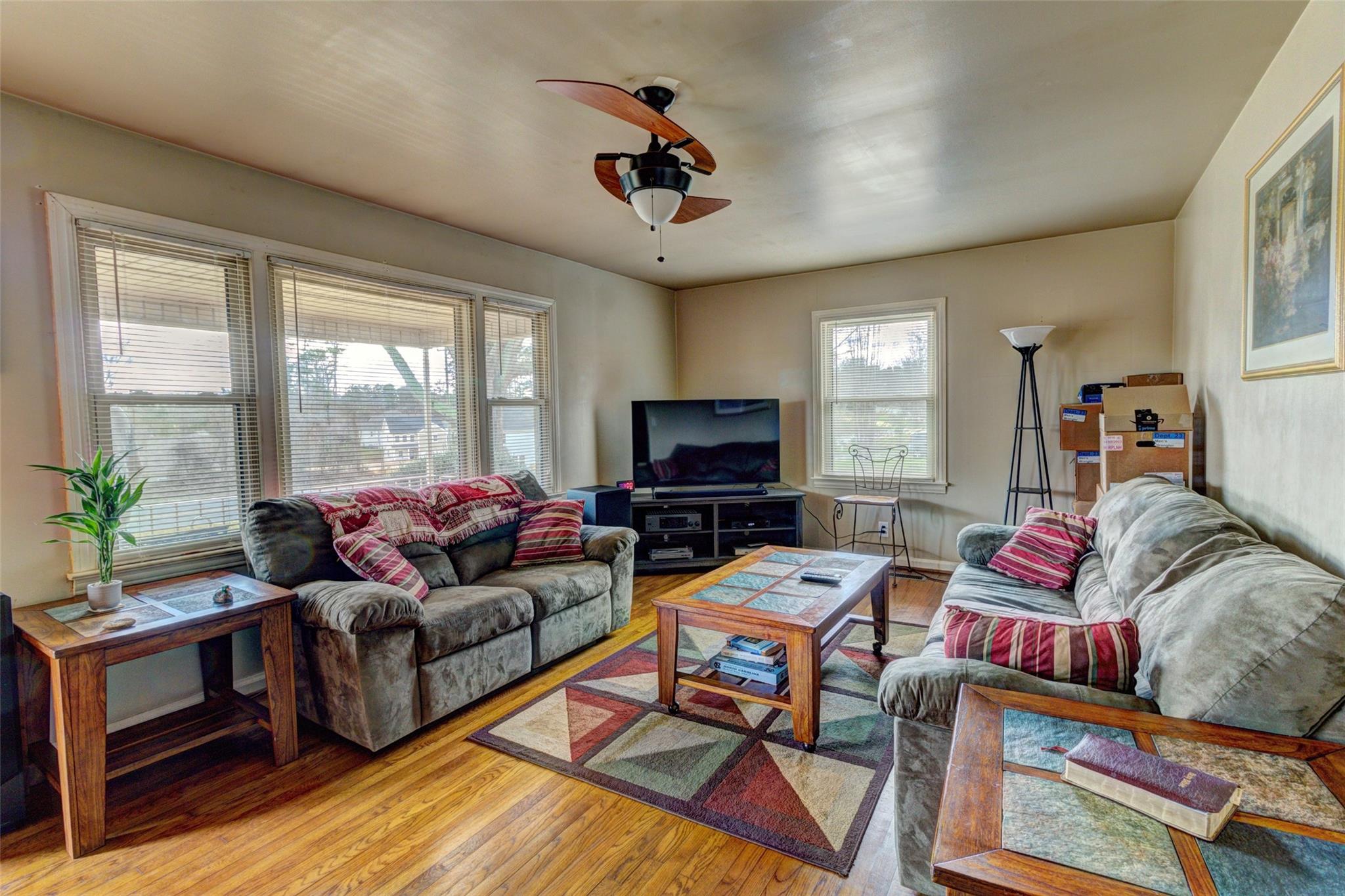 443 Roy Eaker Road Cherryville, NC 28021 - Photo 7 of 15 a living room with furniture a flat screen tv and a large window