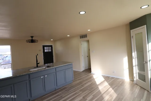 a bathroom with a sink vanity mirror and toilet