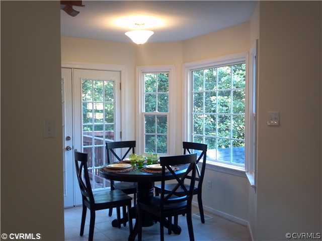 7312 Drexelbrook Road Chesterfield, VA 23832 - Photo 4 of 18 a view of a dining room with furniture and a potted plant
