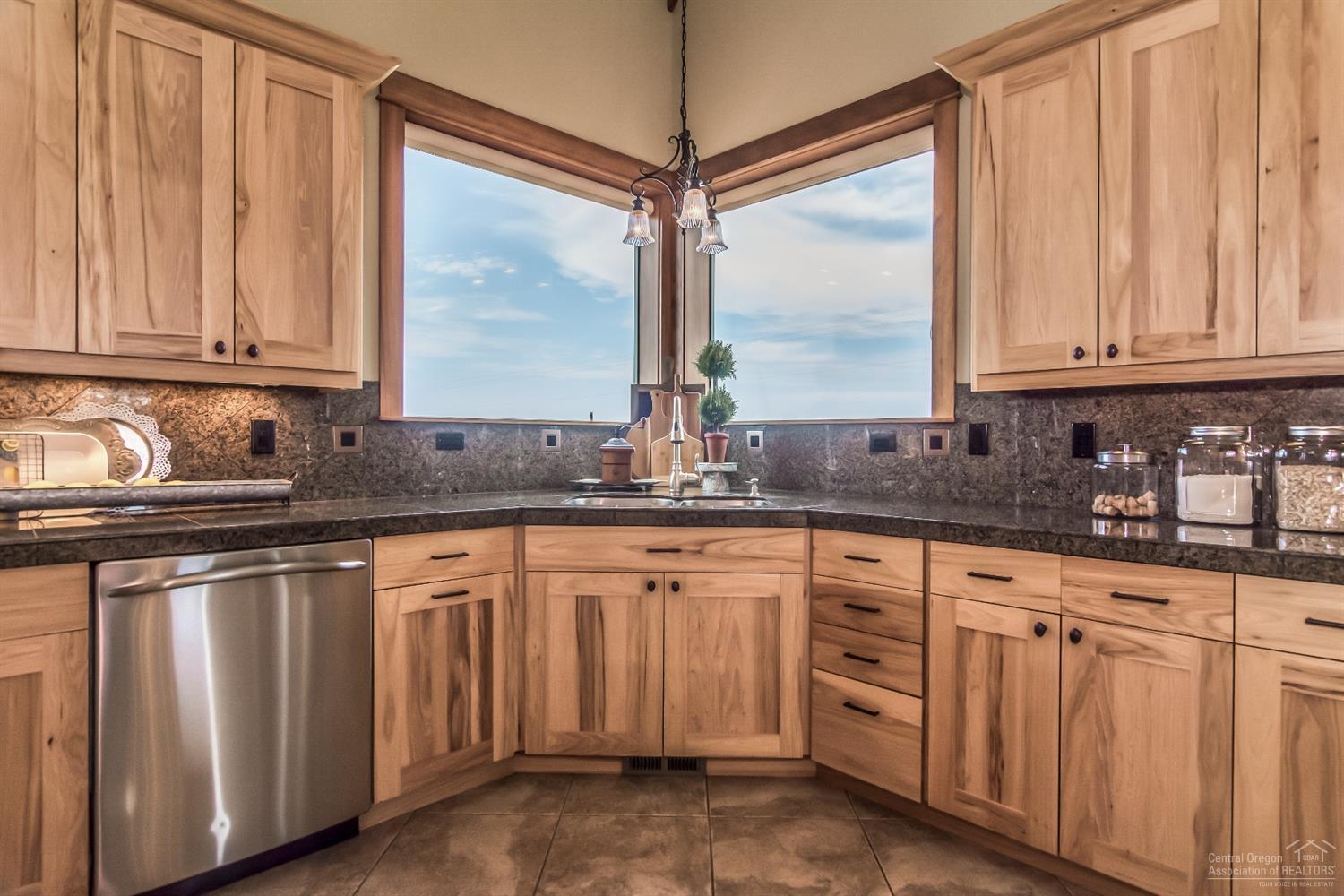 16794 Southwest Cronin Road Powell Butte, OR 97753 - Photo 11 of 25 Corner sink in kitchen with beautiful Mt