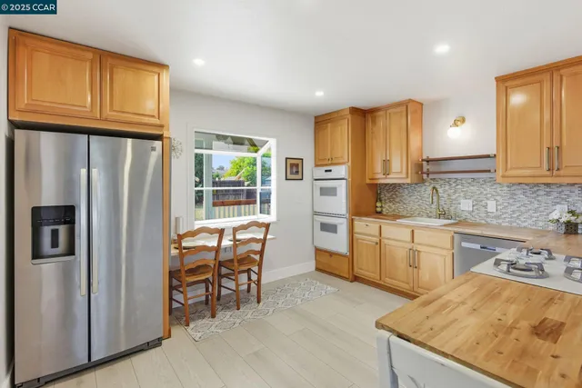 a view of a dining room with furniture and a wooden floor