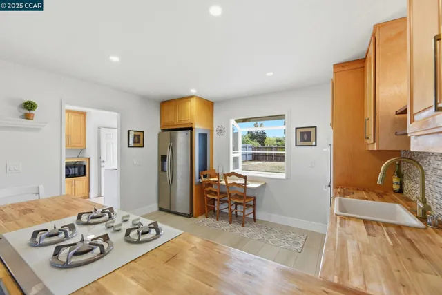 a view of a livingroom with furniture and a window