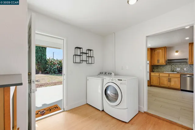 a view of a storage & utility room with washer and dryer
