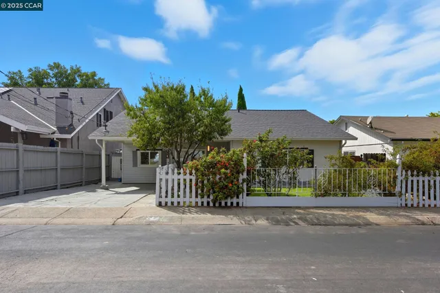 a view of a house with a fence