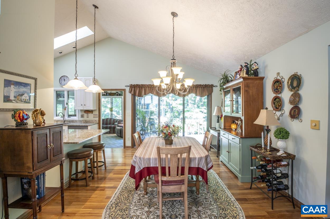 38 Brougham Road Palmyra, VA 22963 - Photo 8 of 38 a dining room with furniture a chandelier and wooden floor