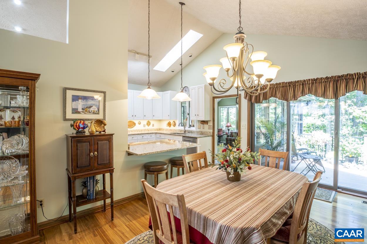 38 Brougham Road Palmyra, VA 22963 - Photo 9 of 38 a view of a dining room with furniture a chandelier and wooden floor
