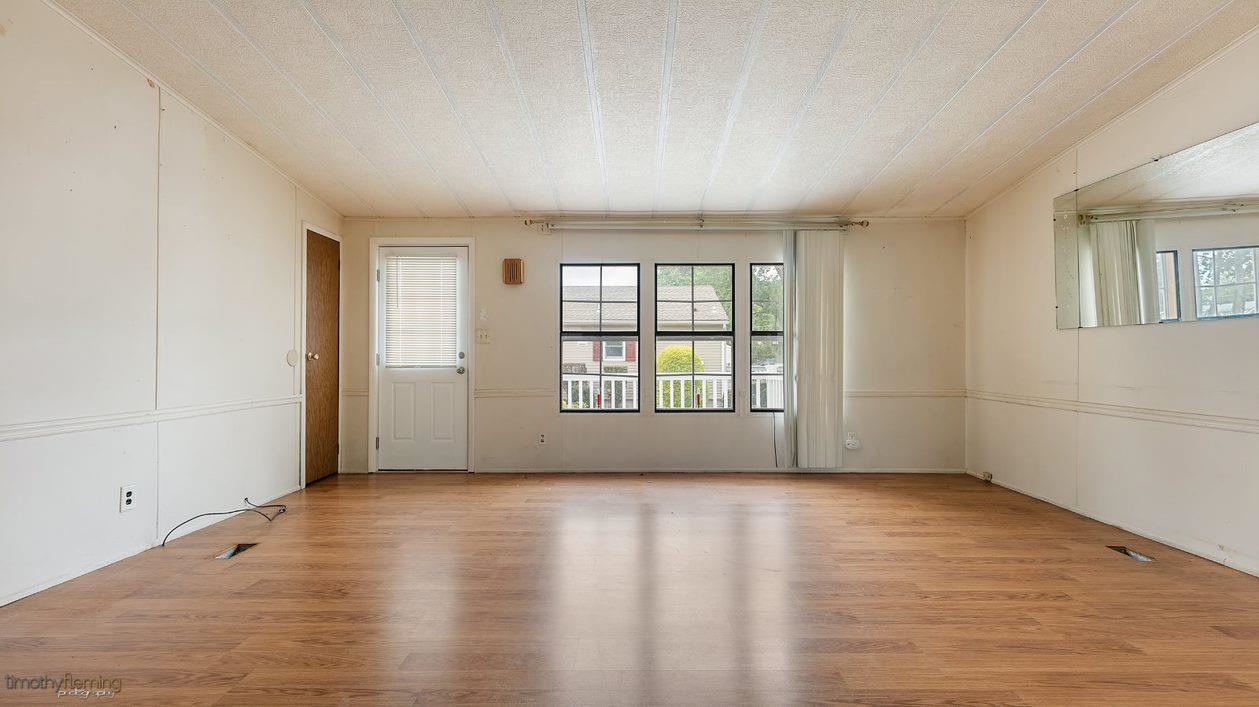 7 Denn Street Rio Grande, NJ 08242 - Photo 12 of 17 wooden floor in an empty room with a window