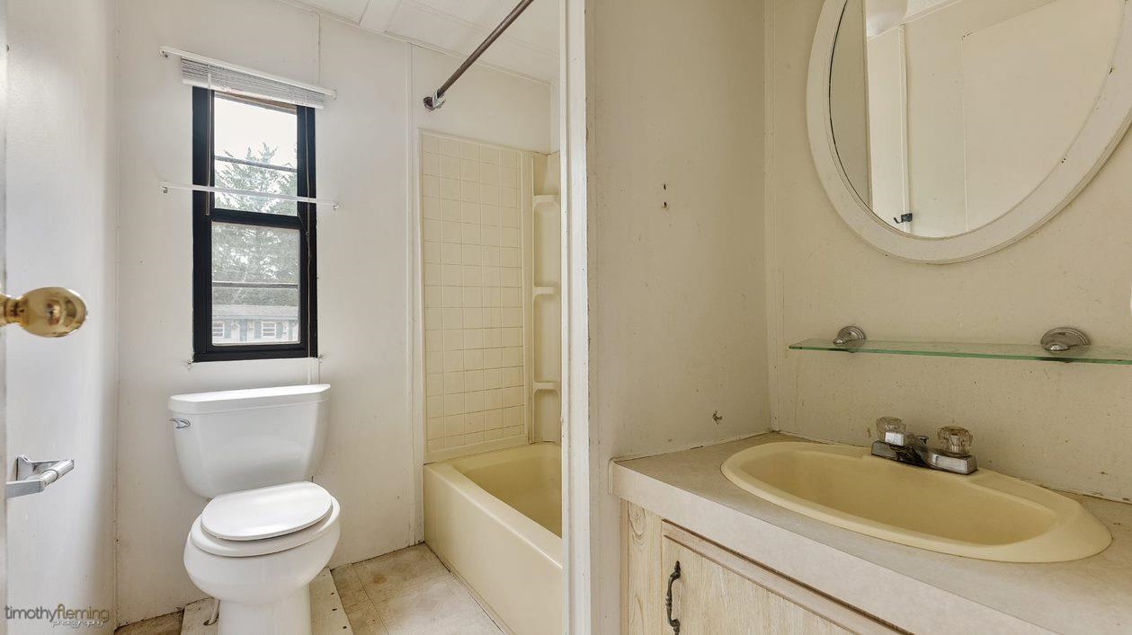 7 Denn Street Rio Grande, NJ 08242 - Photo 13 of 17 a bathroom with a toilet sink and mirror