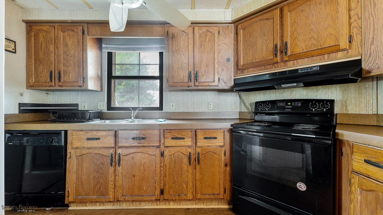 7 Denn Street Rio Grande, NJ 08242 - Photo 8 of 17 a kitchen with granite countertop a stove top oven cabinetry and granite counter tops