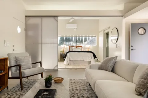 a bed room with a bed and a couch