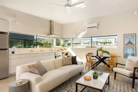 a view of a kitchen from a hallway
