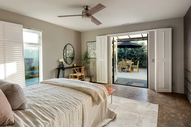 a bathroom with a double vanity sink mirror and shower