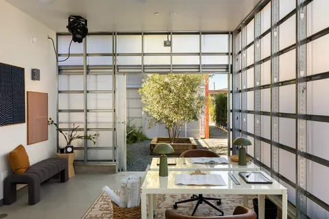 a workspace with furniture and a window