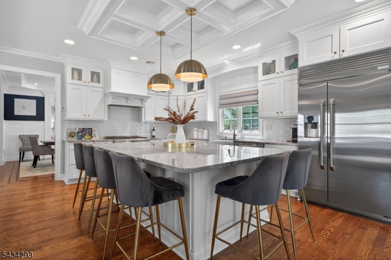 921 Harding Street Westfield, NJ 07090 - Photo 16 of 50 a kitchen with stainless steel appliances a dining table chairs and chandelier