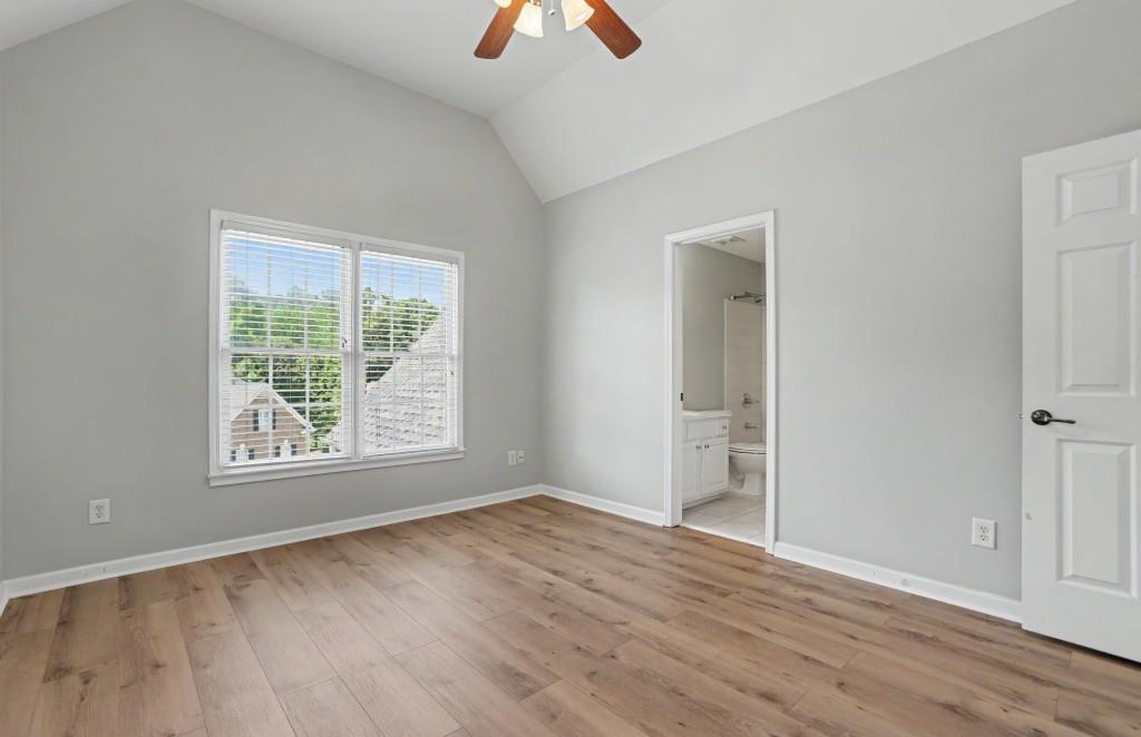 2123 Floral Ridge Drive Dacula, GA 30019 - Photo 43 of 56 a view of an empty room with window and wooden floor