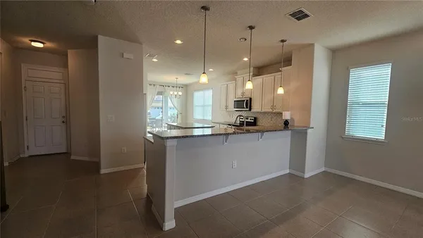 a view of a kitchen and a window
