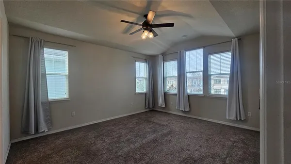 a view of an empty room with a window