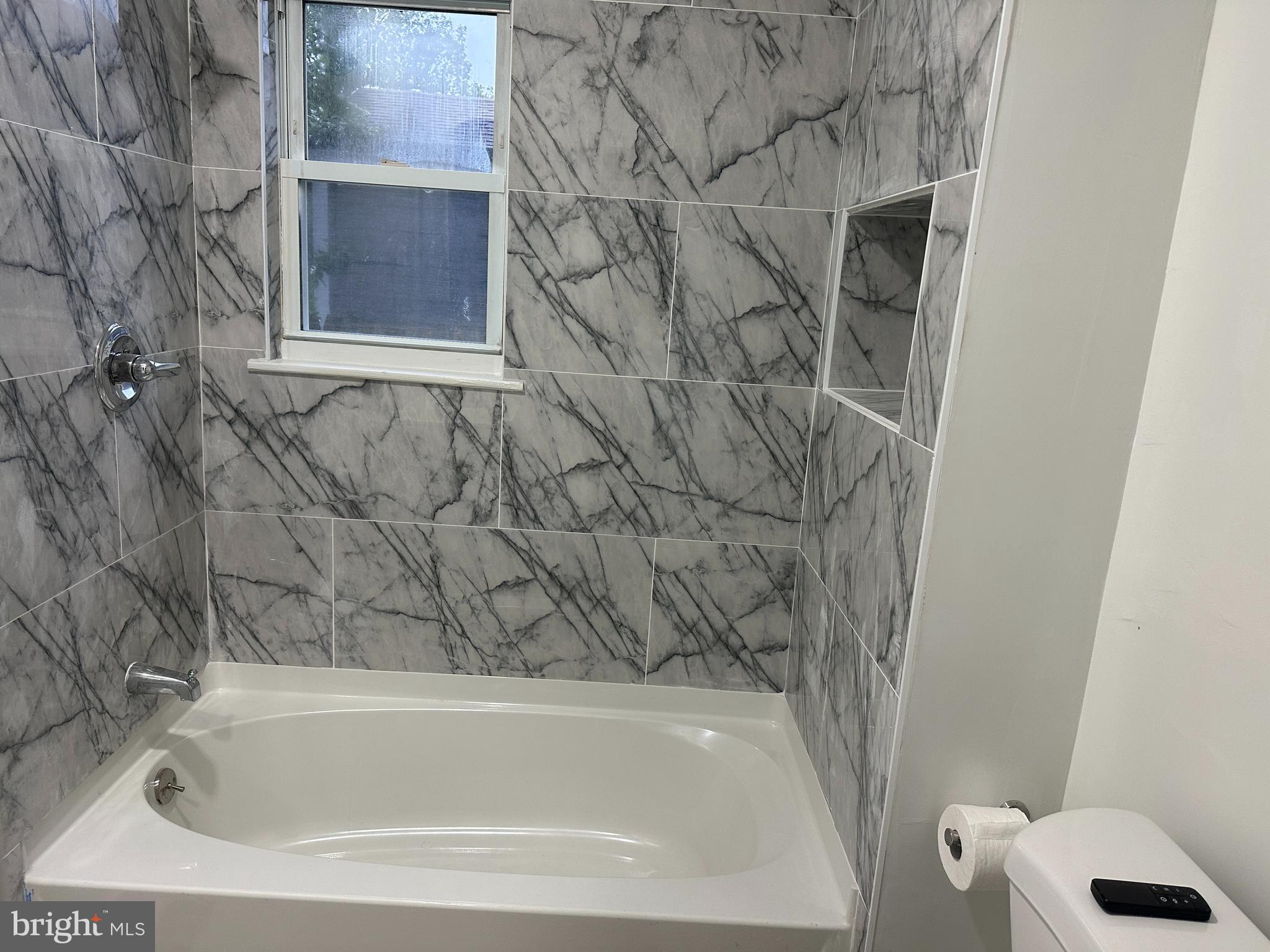8411 11th Avenue Silver Spring, MD 20903 - Photo 12 of 24 a bathroom with a bathtub