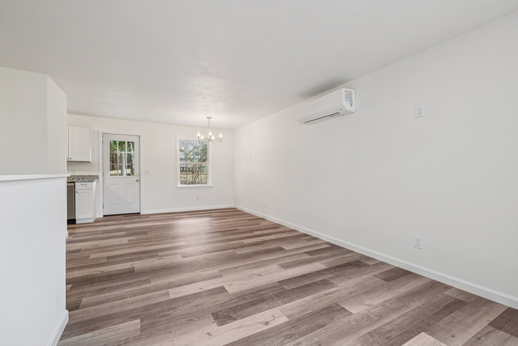 4 Hill Lane Shirley, MA 01464 - Photo 14 of 38 a view of empty room with wooden floor and window