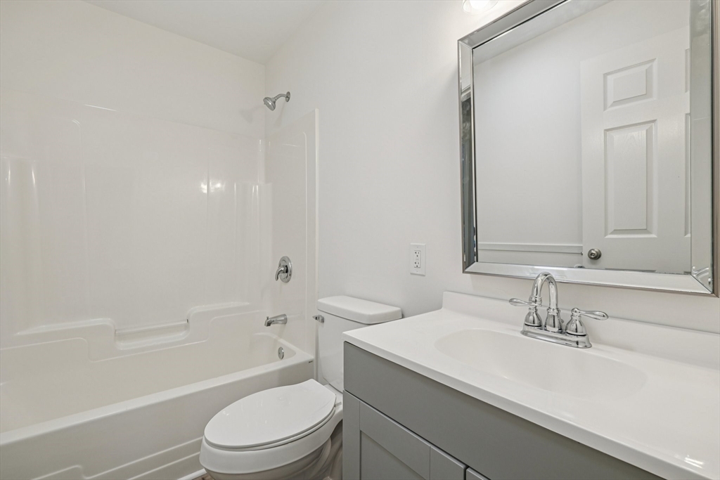 4 Hill Lane Shirley, MA 01464 - Photo 17 of 38 a bathroom with a sink a toilet and shower