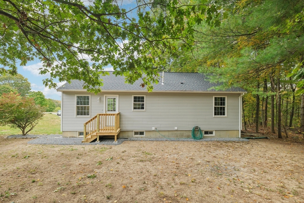 4 Hill Lane Shirley, MA 01464 - Photo 35 of 38 a view of a house with backyard and chairs
