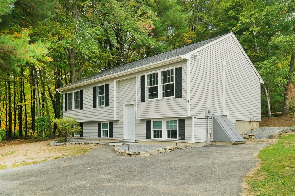 4 Hill Lane Shirley, MA 01464 - Photo 4 of 38 a view of a house with a patio
