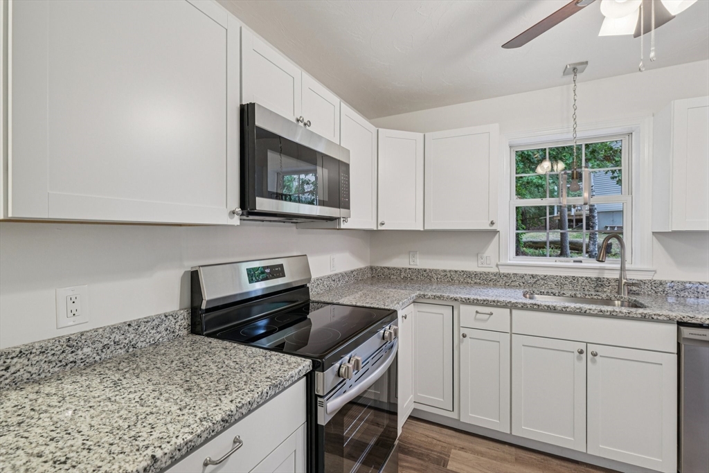 4 Hill Lane Shirley, MA 01464 - Photo 8 of 38 a kitchen with a sink stove and microwave