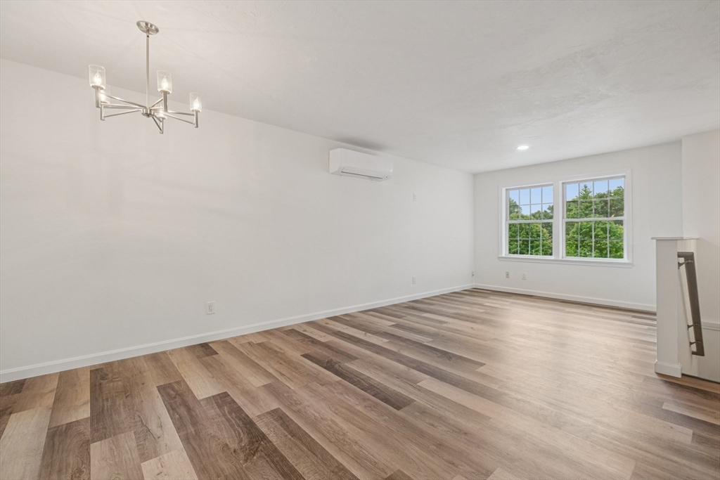 4 Hill Lane Shirley, MA 01464 - Photo 10 of 38 a view of empty room with wooden floor and window