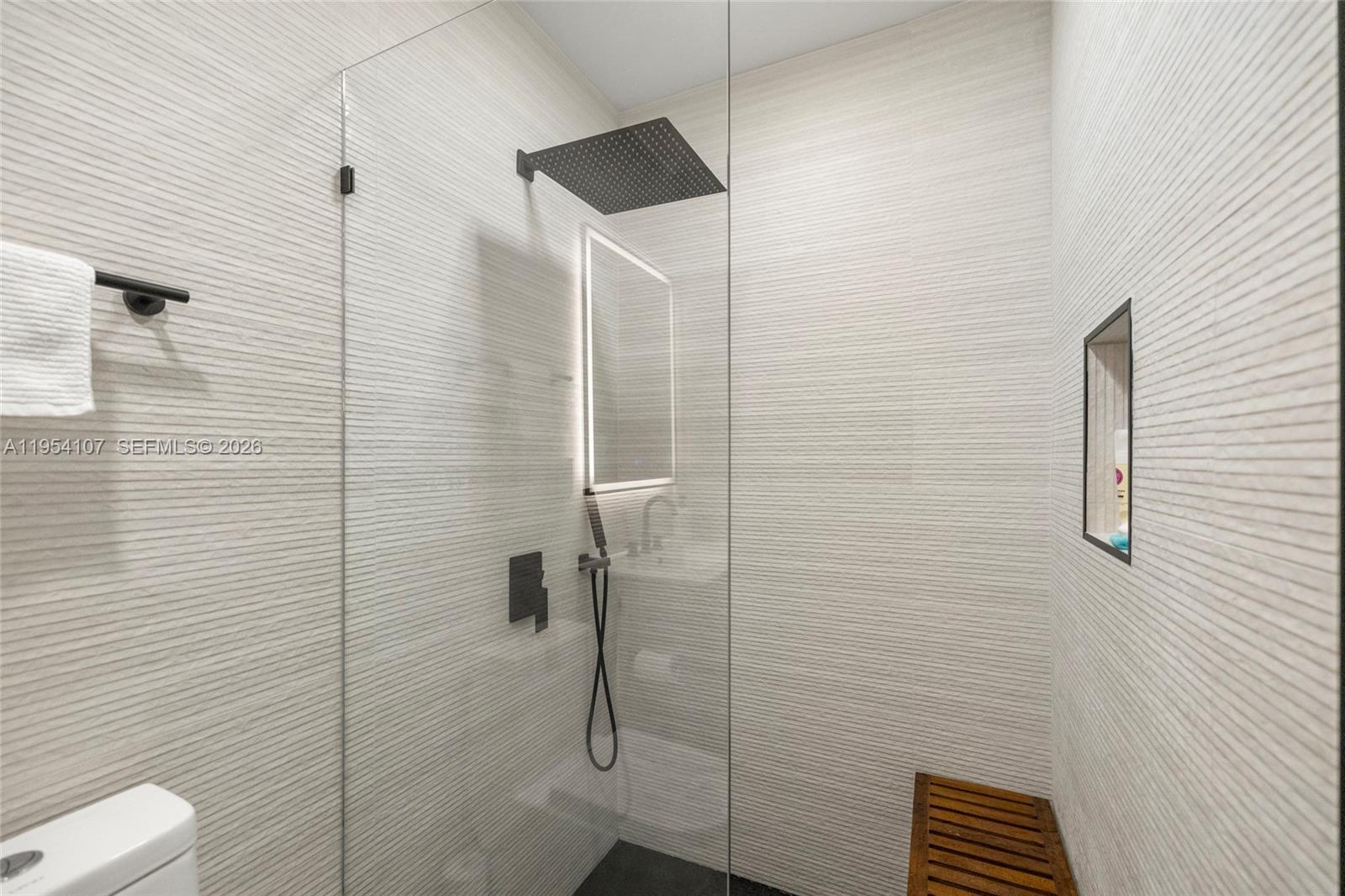 3910 Northeast 27th Terrace Lighthouse Point, FL 33064 - Photo 18 of 55 a bathroom with a shower