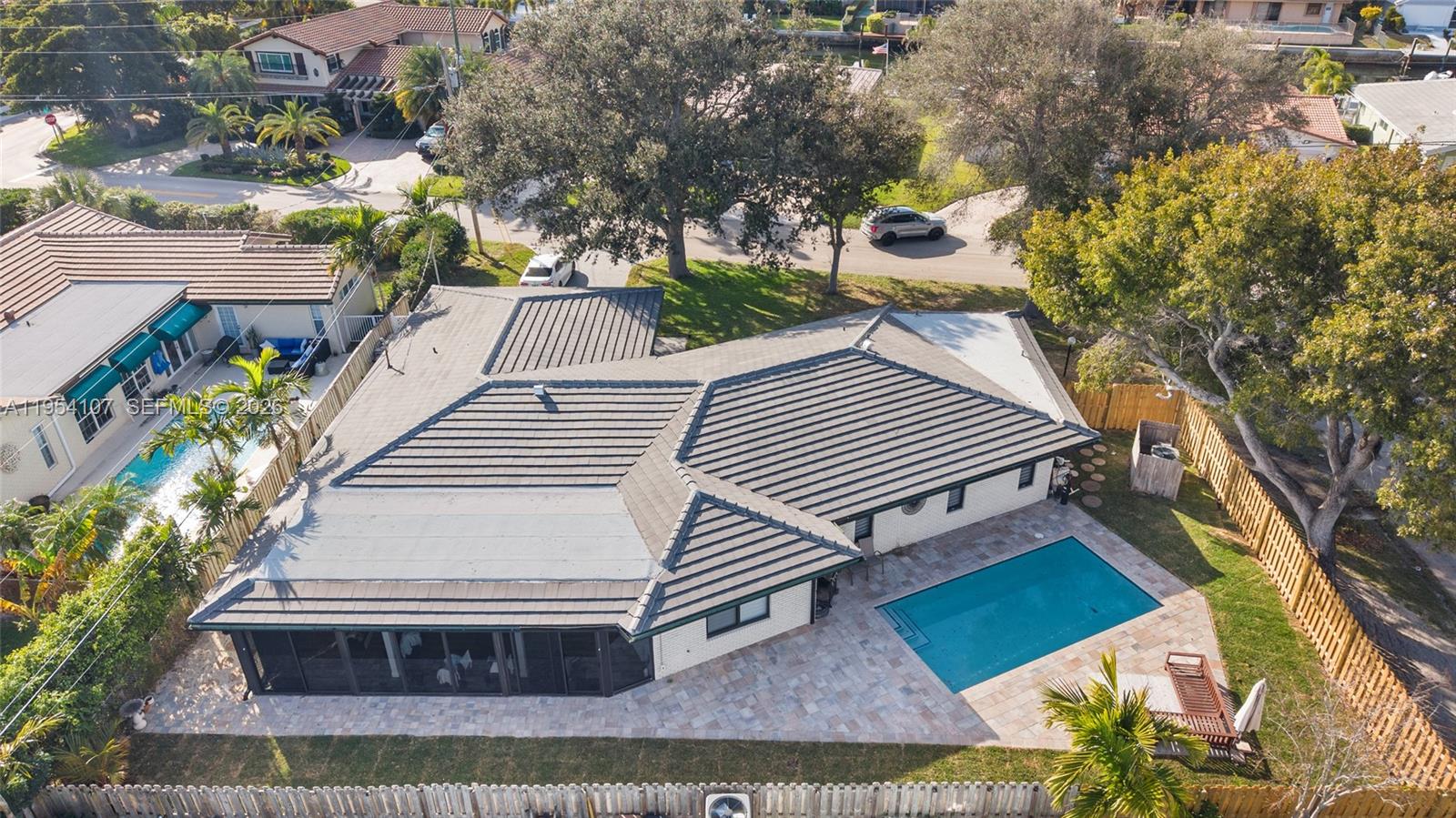 3910 Northeast 27th Terrace Lighthouse Point, FL 33064 - Photo 49 of 55 a view of a house with a yard