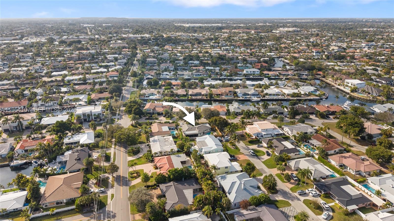 3910 Northeast 27th Terrace Lighthouse Point, FL 33064 - Photo 52 of 55 an aerial view of residential houses with city view