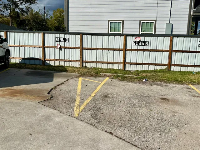 a view of a house with backyard and porch
