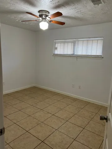 a view of a room that has a window in it