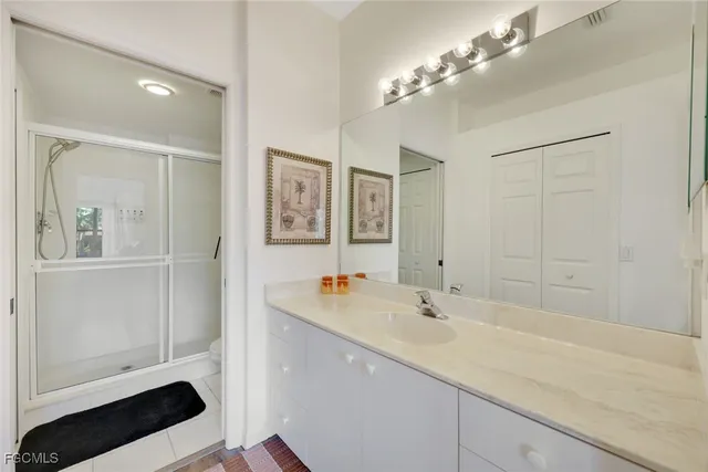 a bathroom with a sink double vanity and a mirror