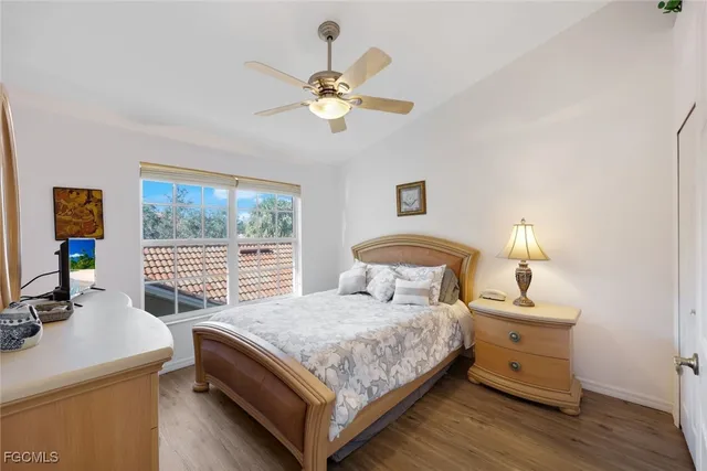 a bedroom with a bed and a table