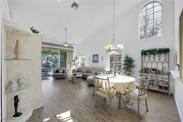 a view of a dining room with furniture window and outside view