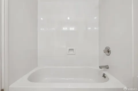 a close up of a bathtub in a bathroom