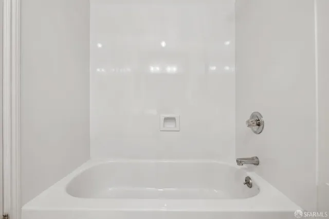a close up of a bathtub in a bathroom