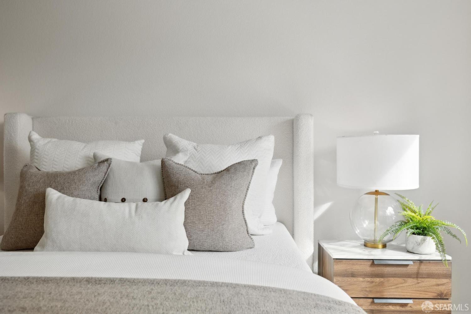 550 South Van Ness Avenue, Unit 207 San Francisco, CA 94110 - Photo 17 of 22 a large white bed in a white room