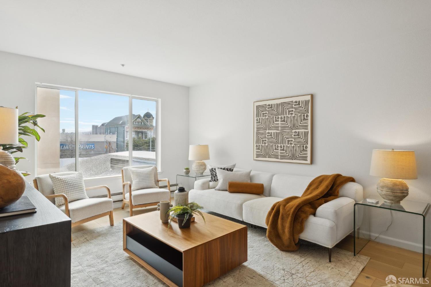 550 South Van Ness Avenue, Unit 207 San Francisco, CA 94110 - Photo 4 of 22 a living room with furniture and a large window
