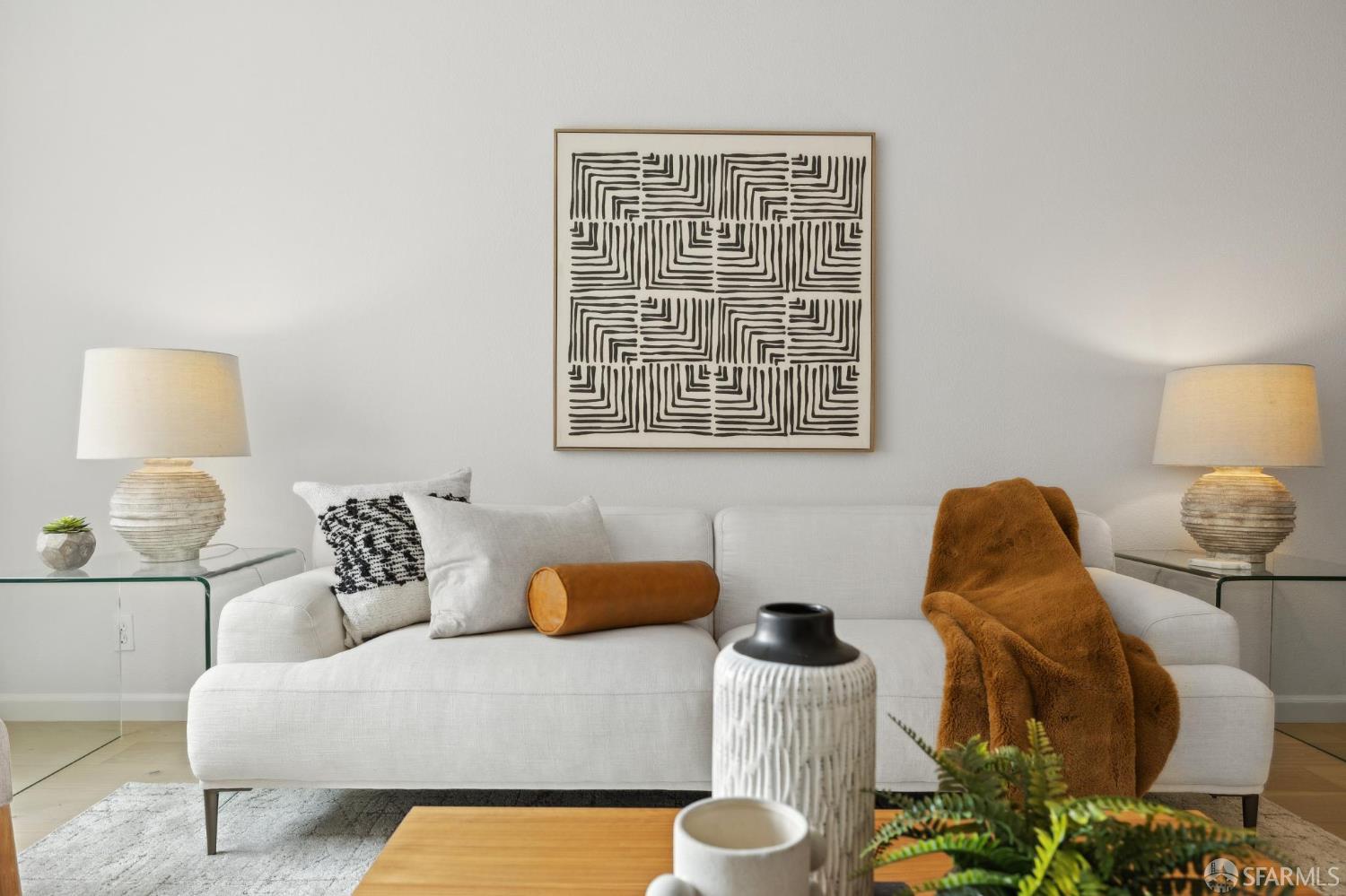 550 South Van Ness Avenue, Unit 207 San Francisco, CA 94110 - Photo 5 of 22 a living room with furniture and a lamp
