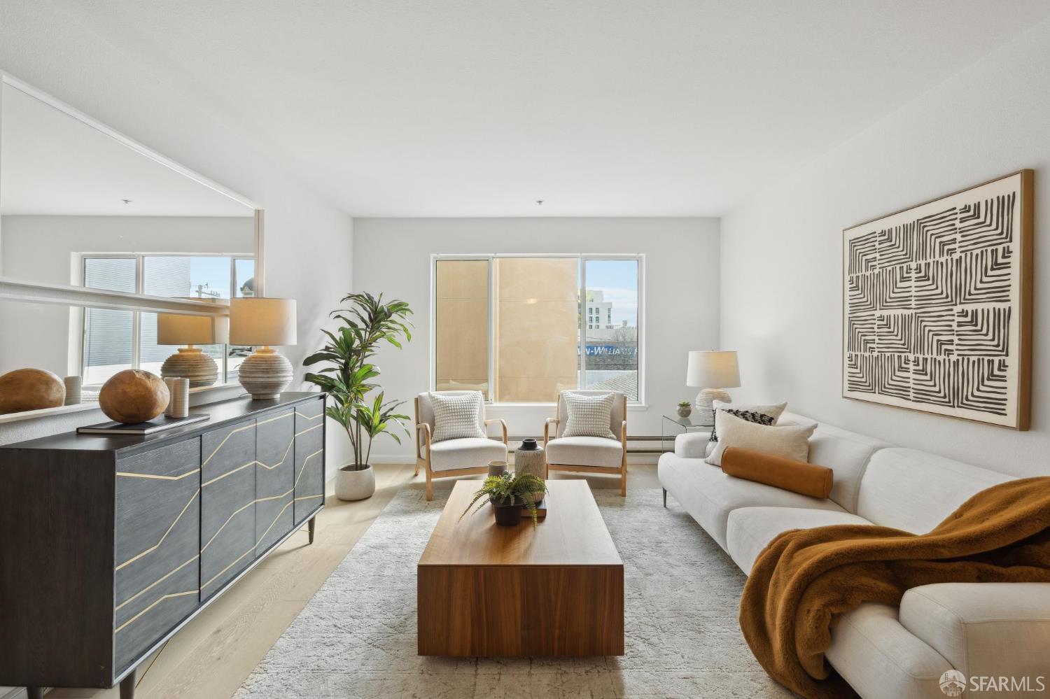 550 South Van Ness Avenue, Unit 207 San Francisco, CA 94110 - Photo 6 of 22 a living room with furniture and a large window